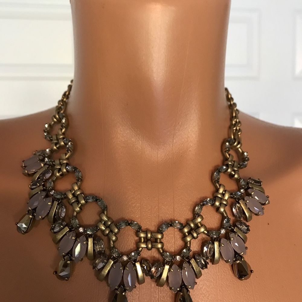 Gold tone necklace with soft pink and clear stones